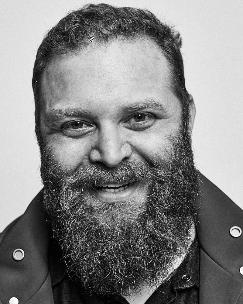 Black and white studio headshot of Barry Hott smiling